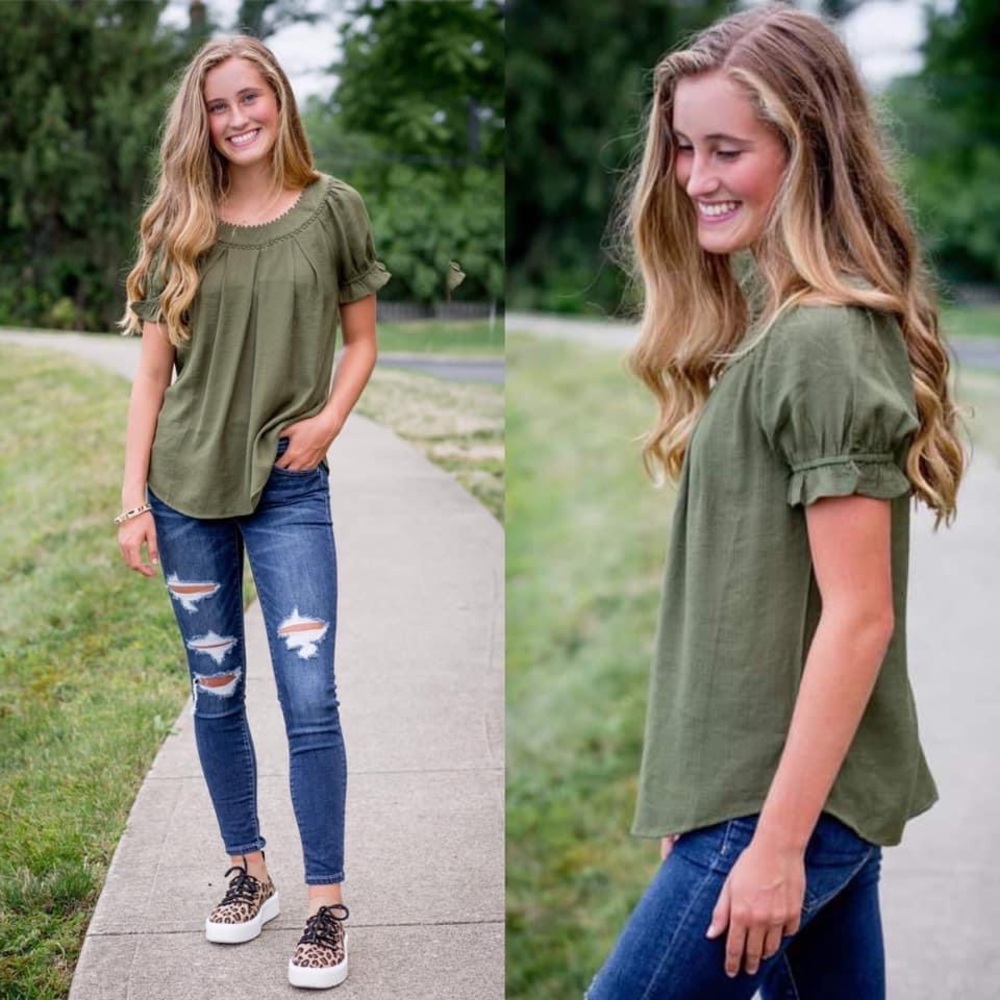 Beautiful ruffle sleeve top. Ruched detail. Elastic on arms.